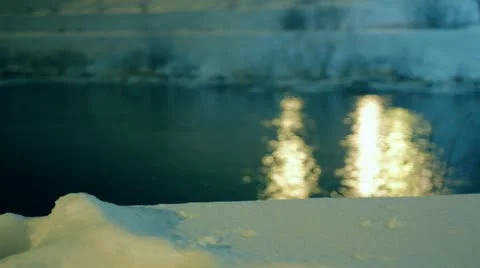 Night timelapse of a snow covered river bank Stock Footage 10821380