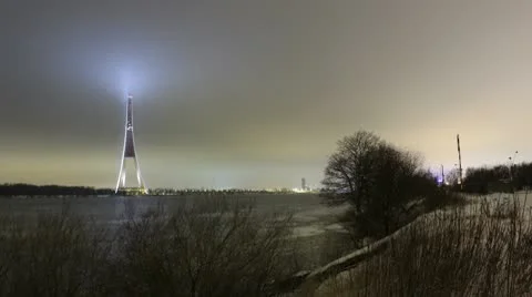 Night timelapse of winter river and high tower 1080 Stock Footage 10768795