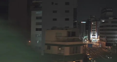 Night Tokyo from subway train window.Modern buildings and neon lights., highways Видео 136287254