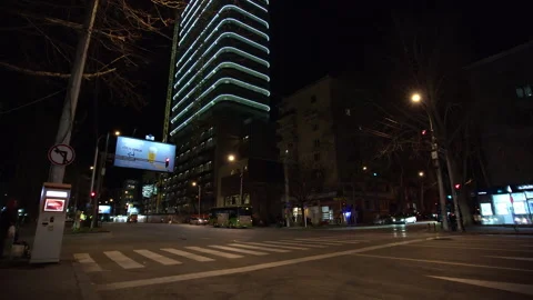 Night Traffic and Modern Neon Building Wide Shot Video stock 331041753