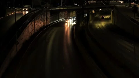 Night traffic with car headlights on a dark highway Stock Footage 340281041