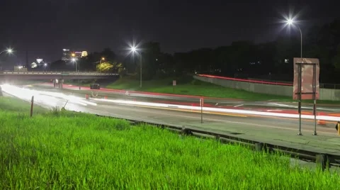 Night Traffic in front of the Cityscape Video stock 65320431