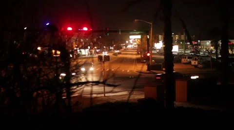 Night Traffic at Intersection Through Bushes Stock Footage 46415165