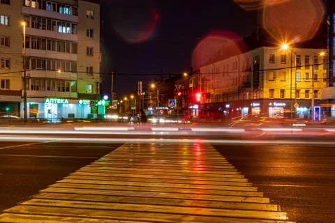 Night traffic lights at a crosswalk Stock Photos