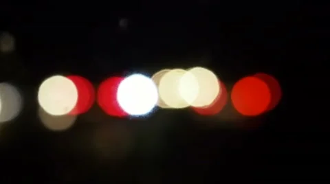 Night traffic in the rain. Defocused headlights and taillights. Stock Footage 54091841