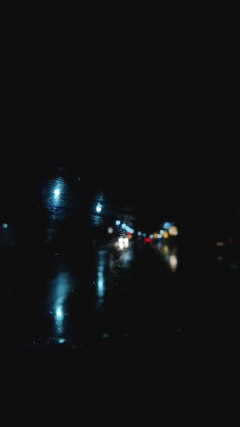 Night traffic scene during the storm with a view to the lightnings through the c Stock Footage 277296944