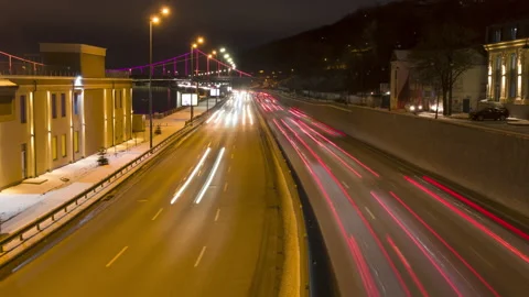 Night traffic time lapse. Traces of headlights and brake lights. Zoom in Stock Footage 169958133