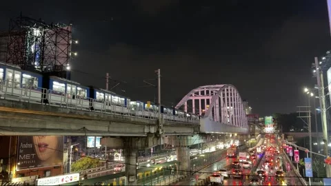 Night train crossing river from Makati to Mandaluyong 4K 30fps Stock Footage 337950382