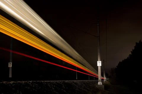 Night train light marks passing by. High speed long exposure Stock Photos