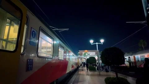 Night Train At Marrakech Station With Passengers Boarding Under Streetlights Stock Footage 302905934