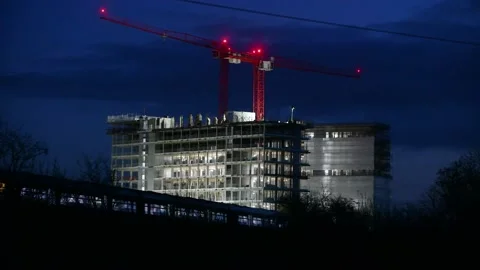 Night train running across front of construction site Stock Footage 143921376