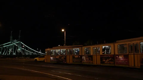 NIGHT TRAMS IN FRONT OF LIBERTY BRIGDE Stock Footage 39390473