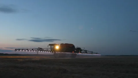 Night treatment of fields from pests Stock-Footage 245783047