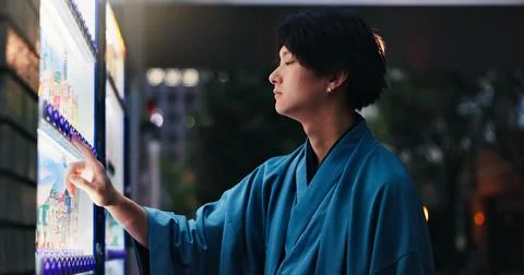 Night, vending machine and thinking with Japanese man in city for food decision Stock Photos