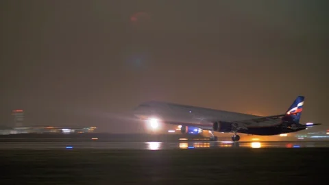Night view of Aeroflot plane take-off at Sheremetyevo Airport, Moscow Stock Footage 94316179