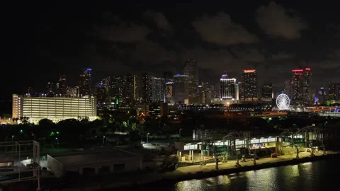 Night view from afar of Miami, Florida, from port, cruise terminal. Industrial Stock-Footage 275584969