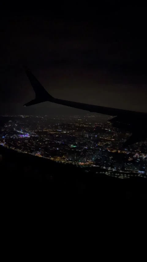 Night view from an airplane window over a city Stock Footage 337127517