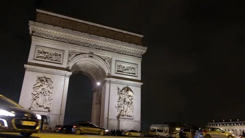 Night view of the Arc de Triomphe at champs elysees with vehicular traffic Stock Footage 99952435