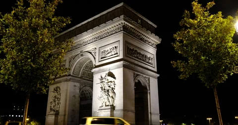 Night view of the Arc de Triomphe in Paris, majestic classical architecture Stock Footage 329168498