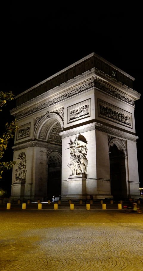 Night view of the Arc de Triomphe in Paris, majestic architecture and traffic Stock Footage 329171044