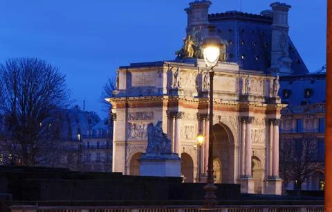 Night view on arch of triumph Carousel and Tuileries garden, Paris, France. Stock Photos