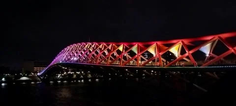 Night view of Atal Bridge, a footbridge over Sabarmati River, Ahmedabad, Gujarat Stock Footage 294700277