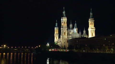 Night view of Basilica by the river from bridge Stock Footage 39323643