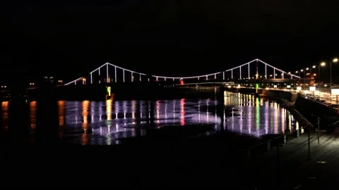 Night view of a beautiful multi-colored illumination on the bridge. Reflection Stock-Footage 132591519