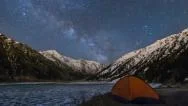 Night View Of The Big Almaty Lake In Mountains With The Tent In Front Stock Footage