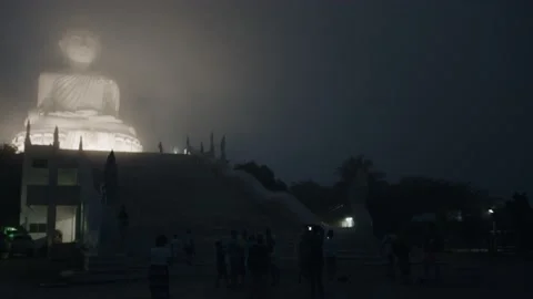 Night view of the Big Buddha statue, huge fog, handheld shot | Thailand Stock Footage 223302076