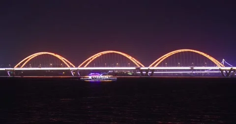 Night view of a boat and cable-stayed bridge over Xiangjiang River, Furong .. Stock Footage 238653772