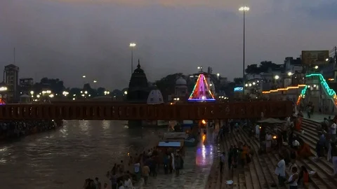 Night view from the bridge to burning lights and pilgrims, temples, bridges Gang Stock Footage 107558765