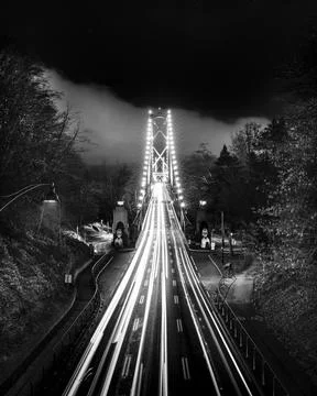 Night view of a bridge with light trails Stock Photos