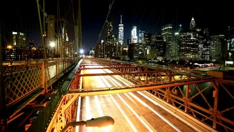 Night View of Brooklyn Bridge with Manhattan Skyline and Traffic Light Trails Stock-Footage 310650106