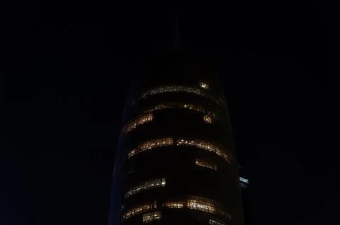 Night View of Burj Doha (Doha Tower) with Illuminated Facade, Qatar. Stock Photos