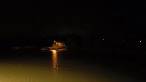 Night view of a calm river with a lit pier. Stock Footage 312517576