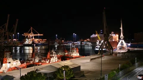 Night view of cargo ships docked at Port of Koper, Slovenia Stock Footage 161011885