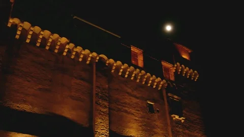 Night view of a castle with the moon - Pan Stock Footage 90294640