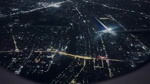 Night view of the city from the airplane window Stock Footage 234052212