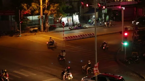 Night view of a crossroad with traffic light in Hanoi, Vietnam Stock Footage 67175908