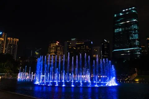 Night view of the dancing multi-colored fountains. Show of Singing Fountains Stock Photos