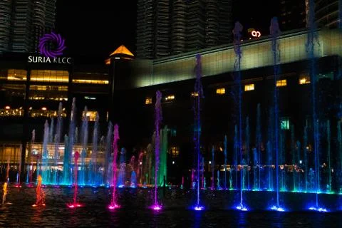 Night view of the dancing multi-colored fountains. Show of Singing Fountains Stock Photos