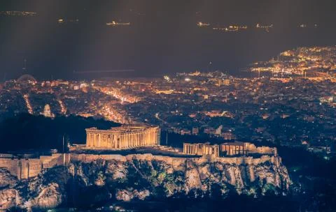 Night view of famous Acropolis in Athens in Greece in warm colors. Stock Photos