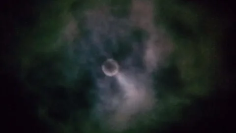 The night view of the full moon is covered by black clouds. Stock Footage 309301218