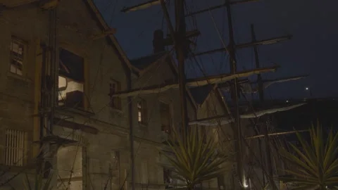 Night View of Historic Stone Buildings and Tall Ship Rigging in The Rocks Stock Footage 345742265