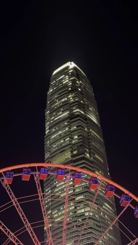 Night View of IFC Tower and Hong Kong Observation Wheel Stock Footage 306762296