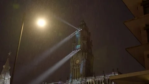 Night view of an illuminated tower with bright light beams. Stock Footage 327624016