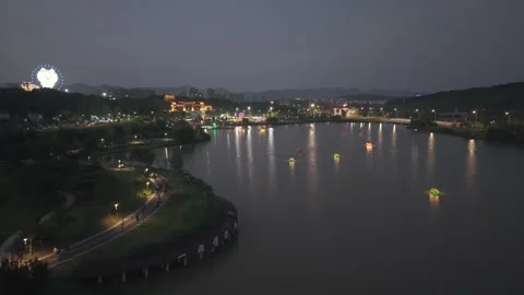 Night View of Lian Mountain Lake with Illuminated Buildings and Ferris Wheel Stock Footage 340210663
