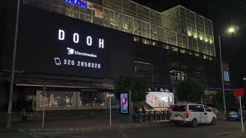 Night View of Lit Building With Large Digital Billboard, Colombia 8K Stock Footage 331524271
