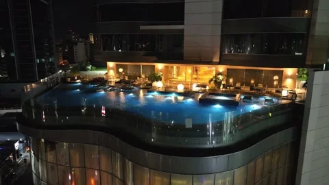 Night View Of Luxurious Embassy Suites Hotel Outdoor Pool. Hotel Hilton In Stock Footage 220821295